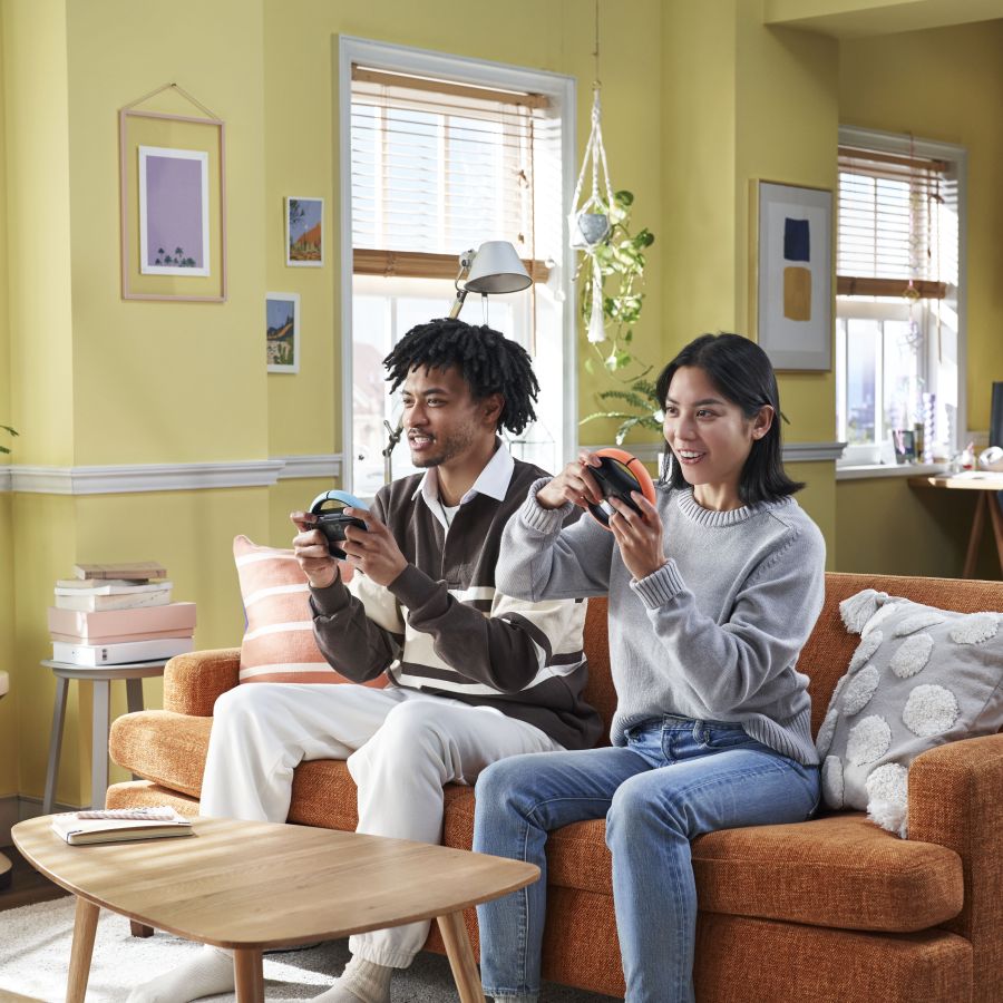 A girl and a boy playing Nintendo Switch 2